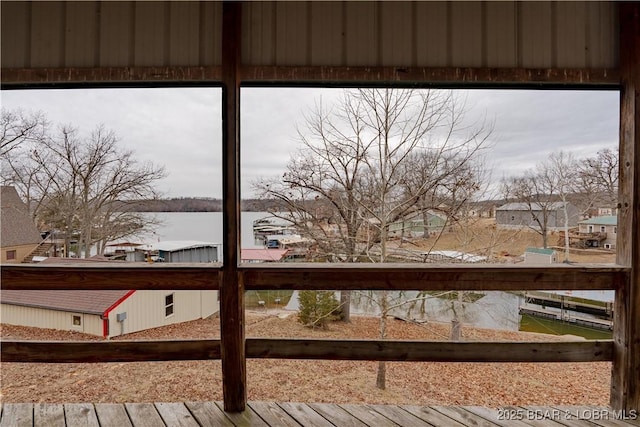 wooden deck featuring a water view