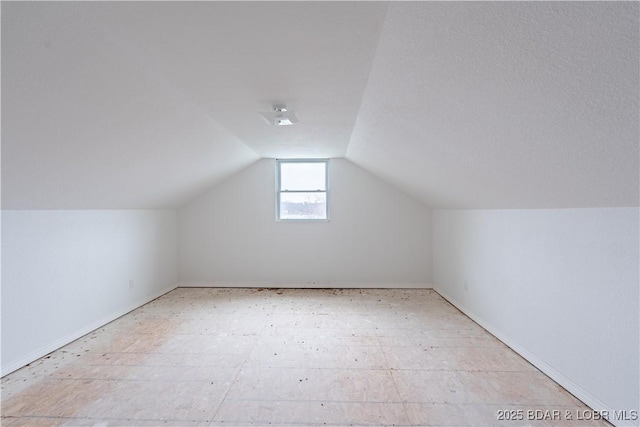 bonus room featuring lofted ceiling