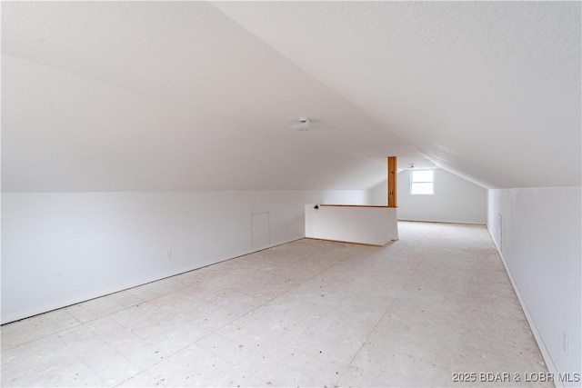 bonus room featuring vaulted ceiling