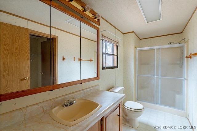 3975 Chelsie Rd, Laurie, MO 65079 - bathroom with a shower with door, vanity, toilet, crown molding, and wallpapered walls
