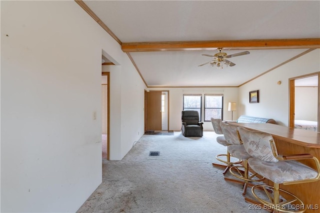 interior space featuring crown molding, light colored carpet, and indoor bar