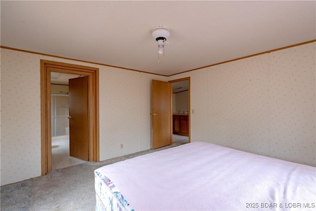 carpeted bedroom with ornamental molding