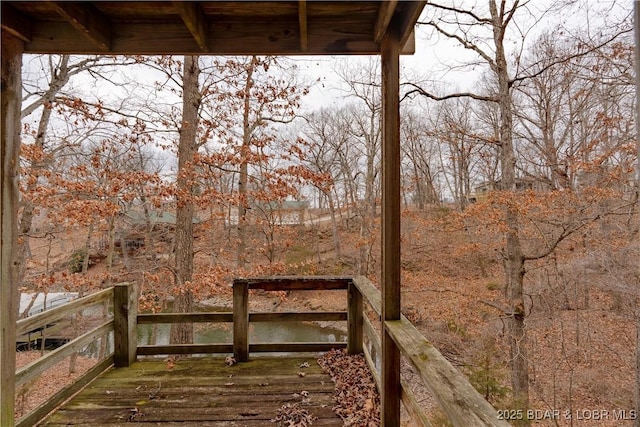 wooden deck with a water view