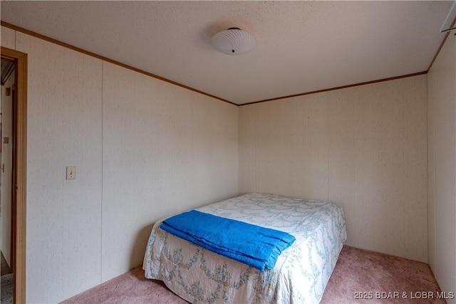 bedroom featuring ornamental molding and carpet floors