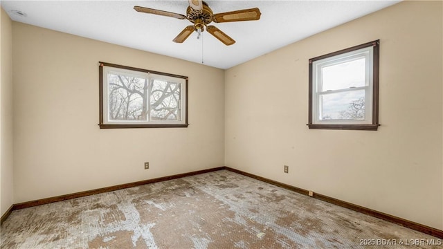 carpeted empty room with ceiling fan