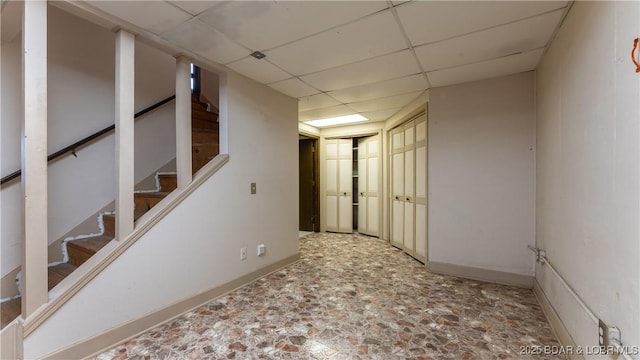 basement featuring a drop ceiling