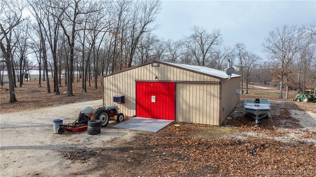 view of outdoor structure with a garage and a water view