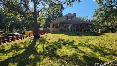 view of front of house with a front lawn