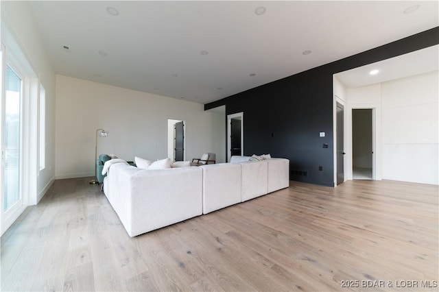 unfurnished living room featuring light hardwood / wood-style floors