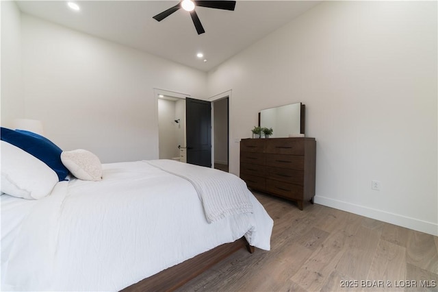 bedroom featuring light hardwood / wood-style floors and ceiling fan