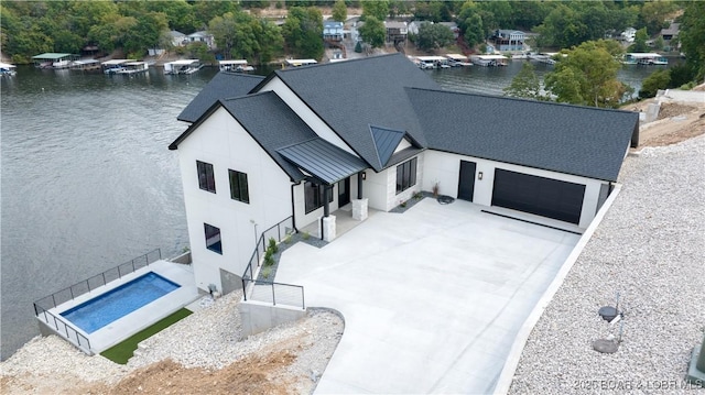 birds eye view of property with a water view