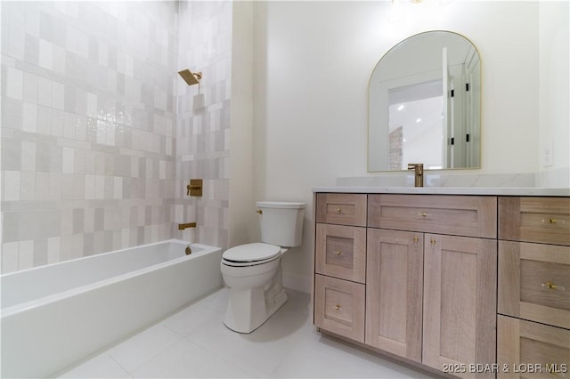 full bathroom featuring tiled shower / bath, vanity, tile patterned floors, and toilet