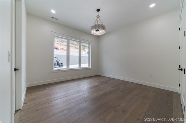 empty room with hardwood / wood-style flooring