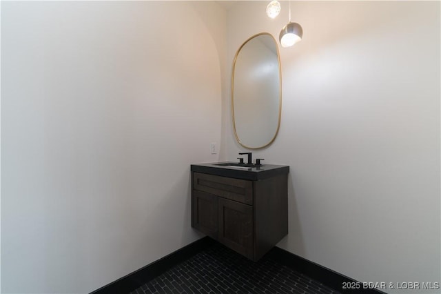 bathroom with tile patterned flooring and vanity