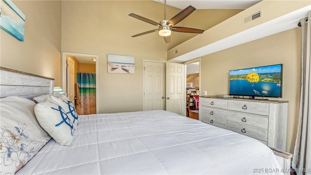 bedroom with ceiling fan and a high ceiling