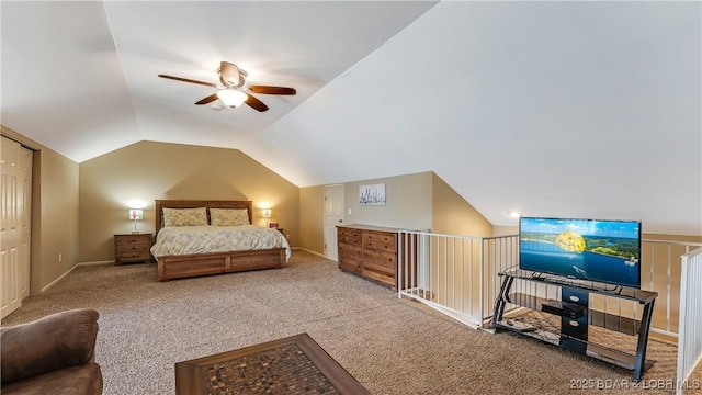 carpeted bedroom with ceiling fan and lofted ceiling