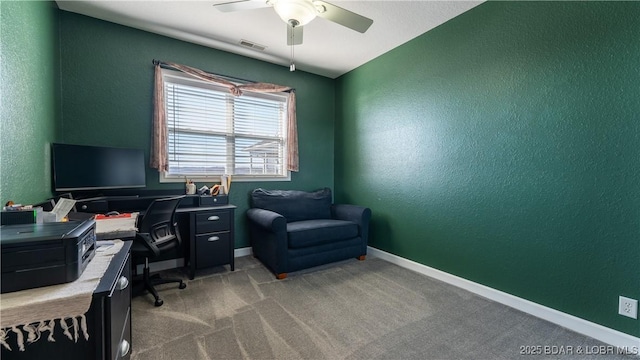 office space with light colored carpet and ceiling fan