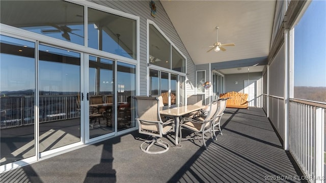 sunroom with vaulted ceiling and ceiling fan