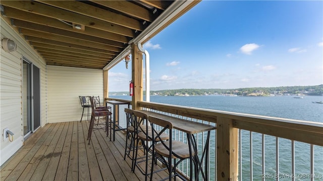 wooden terrace with a water view