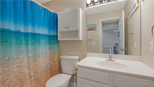 bathroom featuring vanity and toilet