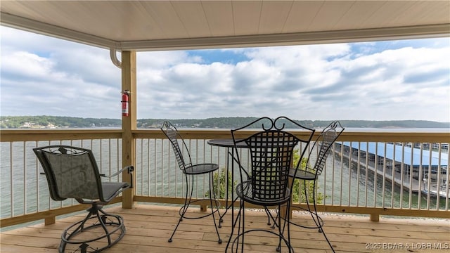 wooden deck with a water view