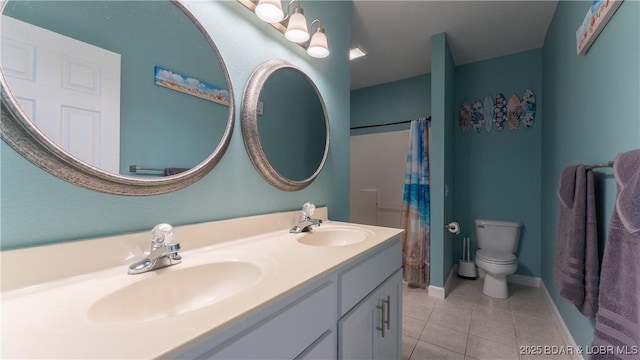 bathroom with a shower with curtain, vanity, toilet, and tile patterned flooring