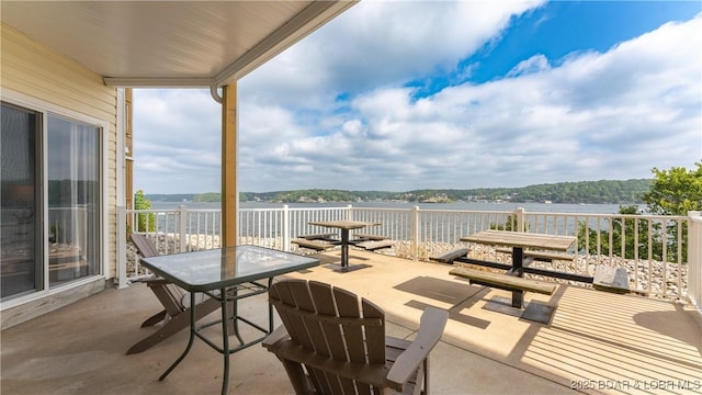 view of patio featuring a water view