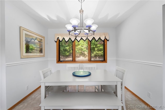 dining room with an inviting chandelier and light tile patterned floors