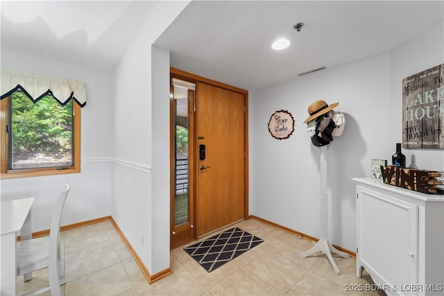 view of tiled foyer entrance