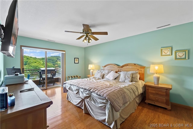 bedroom with ceiling fan, access to exterior, and light hardwood / wood-style floors