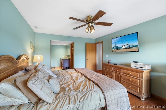 bedroom with light hardwood / wood-style flooring and ceiling fan