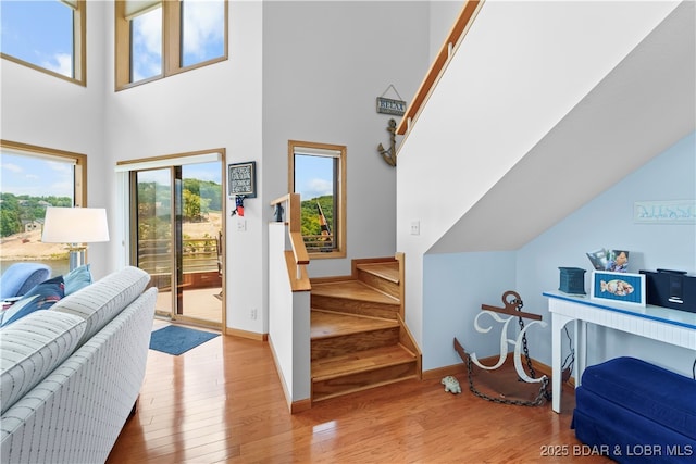 interior space featuring hardwood / wood-style flooring and a high ceiling