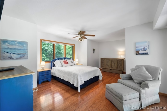 bedroom with ceiling fan and wood-type flooring