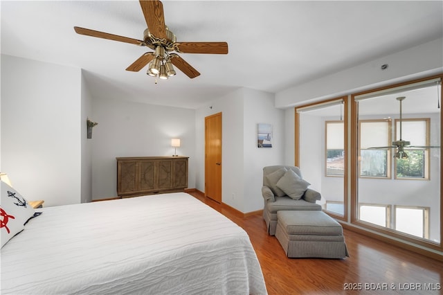 bedroom featuring ceiling fan and light hardwood / wood-style flooring