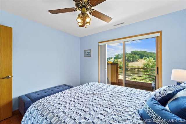 bedroom featuring wood-type flooring, access to outside, and ceiling fan