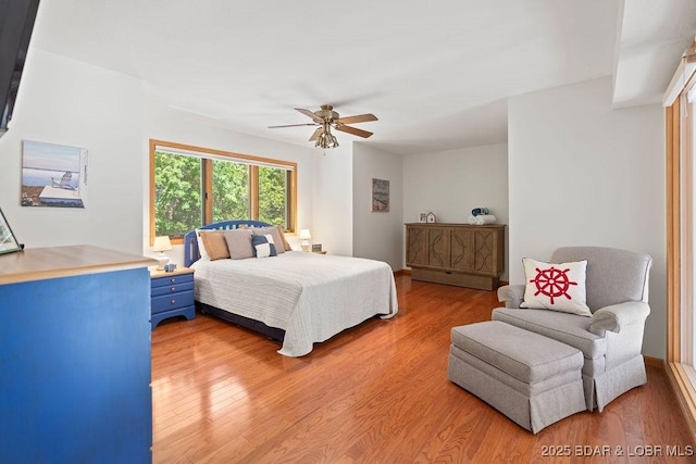 bedroom with light wood finished floors and ceiling fan