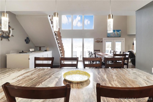 dining space featuring french doors