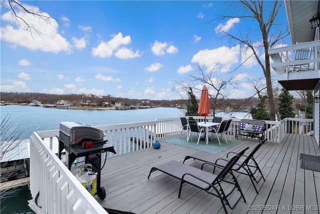 wooden deck featuring a water view