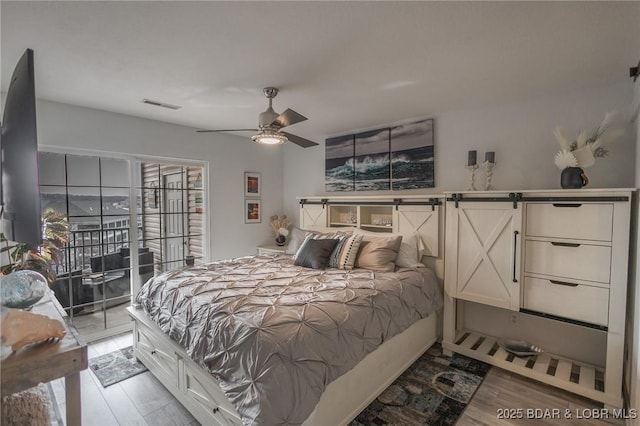 bedroom with ceiling fan, access to exterior, and light wood-type flooring