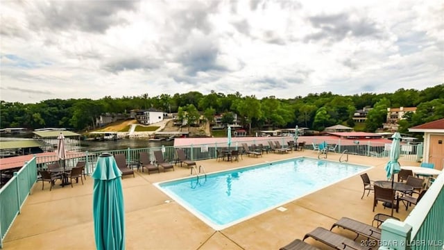 view of swimming pool featuring a patio area