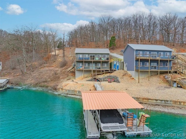 back of house with a water view