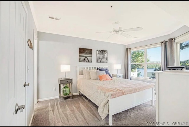 bedroom featuring ceiling fan and carpet