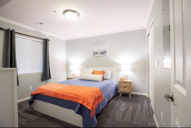 bedroom featuring ornamental molding and dark carpet