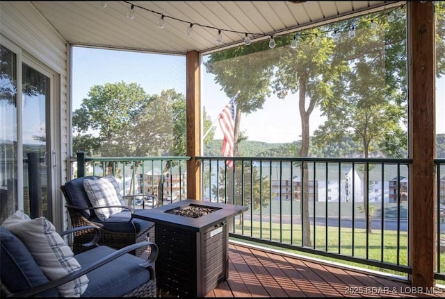 wooden terrace with an outdoor fire pit