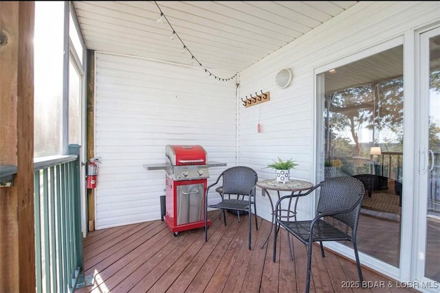 wooden terrace featuring grilling area