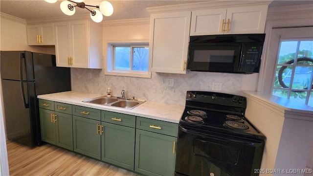 kitchen with green cabinets, black appliances, a sink, white cabinets, and a textured ceiling