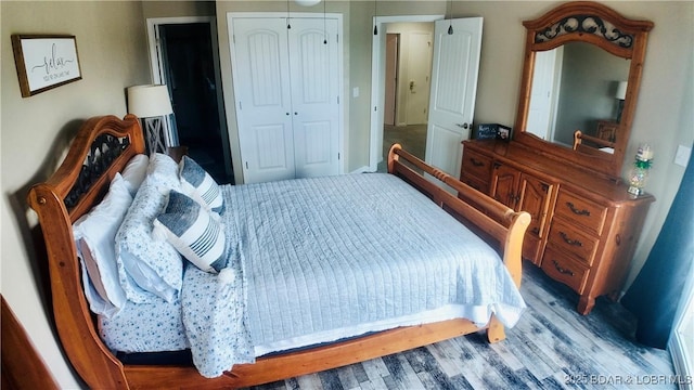 bedroom featuring light hardwood / wood-style flooring and a closet