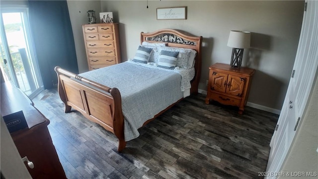 bedroom with dark hardwood / wood-style floors