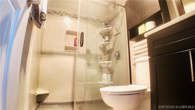 bathroom with an enclosed shower and toilet