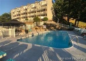 view of swimming pool with a gazebo and a patio